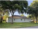 Well-maintained single-story home with a spacious backyard and mature trees, providing ample shade and privacy at 4088 Kingsley St, Clermont, FL 34711