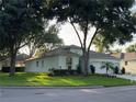 Charming single-story home with a two-car garage and a beautifully landscaped front yard at 4088 Kingsley St, Clermont, FL 34711