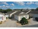 Charming single-story homes featuring manicured landscaping, private driveways, and attached garages in a well-maintained community at 2339 Nehaul Ter, The Villages, FL 32162