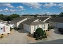 Charming single-story home featuring a well-manicured lawn, a private driveway, and an attached one-car garage at 2339 Nehaul Ter, The Villages, FL 32162