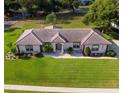 One-story home with tile roof and large yard at 6178 Spinnaker Loop, Lady Lake, FL 32159