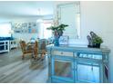 Bright and airy living room with a view into the dining area at 1314 Lajolla Cir, The Villages, FL 32159