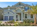 Charming home with stone accents, well-maintained landscaping, and a covered entryway at 14255 Crest Palm Ave, Windermere, FL 34786
