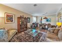 Inviting living room showcasing hardwood floors and a large decorative area rug at 929 Magnolia Blossom Ct, Apopka, FL 32712