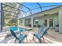 Enjoy the shade of a lanai with a screened pool and patio seating at 929 Magnolia Blossom Ct, Apopka, FL 32712
