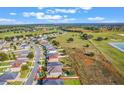 Aerial view of house and surrounding community at 34045 Alameda Dr, Sorrento, FL 32776