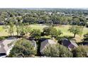 Aerial view of houses near a golf course at 2211 Stonebridge Way, Clermont, FL 34711