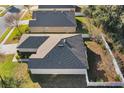 An aerial view shows the roofline, yard, and neighboring properties of this well-maintained home at 2354 Valhalla Dr, Tavares, FL 32778
