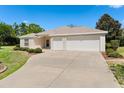 Lovely home featuring an attached two-car garage and a well-maintained front yard at 5009 Harbor Hts, Lady Lake, FL 32159