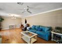 Bright living room featuring hardwood floors and ample natural light at 734 Boylston St, Leesburg, FL 34748