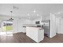Open kitchen with island and stainless steel appliances at Tbd Dogwood Drive Pass # Lot 21, Ocala, FL 34472