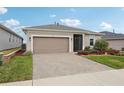 One-story house with a two-car garage at 537 Narrow View Ln, Groveland, FL 34736