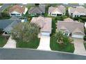 Community overview showing a single-Gathering home with a spacious yard at 1897 Caryle Ln, The Villages, FL 32162