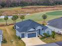 Single-Gathering home on a golf course community with a two-car garage at 3606 Adamsville Ave, The Villages, FL 32163