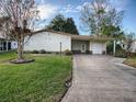 Well-maintained home with a carport at 1710 Hilton Head Blvd, The Villages, FL 32159