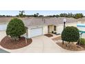 Single-story home with attached garage and landscaping at 17159 Se 78Th Crowfield Ave, The Villages, FL 32162