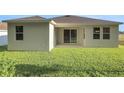 Enjoy the spacious backyard with lush green grass, perfect for outdoor activities and relaxation at 2992 Supermarine Rd, Tavares, FL 32778