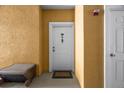 Condo entry with white door and small mat at 3615 Conroy Rd # 614, Orlando, FL 32839