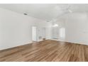Spacious living room featuring wood-look floors and high ceilings at 3806 Doune Way, Clermont, FL 34711