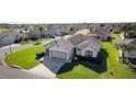 Single-Gathering home in a residential neighborhood with a lake nearby at 11038 Se 170Th Lane Rd, Summerfield, FL 34491