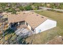 Home featuring a large backyard patio and screened enclosure at 26650 Pelican St, Eustis, FL 32736