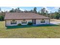 One-story house with large backyard and driveway at 26650 Pelican St, Eustis, FL 32736