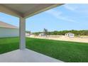 Large backyard featuring new construction homes and a graded lawn at 2833 Supermarine Rd, Tavares, FL 32778