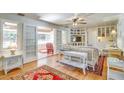 Inviting living room with hardwood floors, comfortable seating, and lots of natural light at 422 W 11Th Ave, Mount Dora, FL 32757
