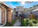 Front entrance of a townhome with a walkway and small patio at 624 Maple Oak Cir # 108, Altamonte Springs, FL 32701