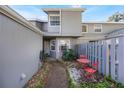 Small private patio with red metal table and chairs at 624 Maple Oak Cir # 108, Altamonte Springs, FL 32701