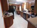 Well-equipped kitchen featuring stainless steel appliances at 106 Hibiscus Way, Leesburg, FL 34748