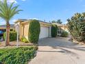 Charming single-story home with manicured landscaping and attached two car garage at 3213 Archer Ave, The Villages, FL 32162