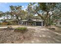 House exterior with a basketball hoop and spacious yard at 505 W Catawba St, Fruitland Park, FL 34731