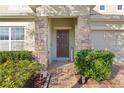 Front entrance with stone columns and landscaping at 1741 Bonser Rd, Minneola, FL 34715