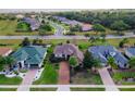 An aerial shot of the house and surrounding neighborhood at 38626 Lakeview Walk, Lady Lake, FL 32159