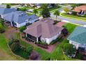 Aerial view showcasing the home's backyard and landscaping at 38626 Lakeview Walk, Lady Lake, FL 32159