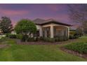 Spacious screened porch with seating area and backyard view at 38626 Lakeview Walk, Lady Lake, FL 32159