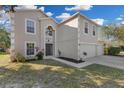 Two-story house with a two-car garage and manicured lawn at 632 Monte Vista Way, Winter Garden, FL 34787