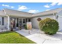 Inviting front entrance with landscaped walkway at 1228 Zapata Pl, The Villages, FL 32159