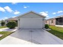 Attached garage with screen door at 1228 Zapata Pl, The Villages, FL 32159