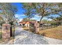 Long driveway leading to a charming house at 18033 Rose St, Groveland, FL 34736
