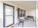 Cozy front porch with seating for relaxing at 1904 De Hoyos Pl, The Villages, FL 32159