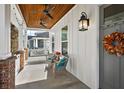 Relaxing front porch with wicker seating and ceiling fan at 2746 Se 19Th Ct, Ocala, FL 34471