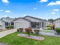 Single-story home with a two-car garage and landscaped front yard at 2806 Salamanca St, The Villages, FL 32162