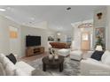 Bright living room featuring a pool table, modern furnishings and ample natural light at 35534 Quail Run, Leesburg, FL 34788