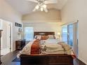Bright bedroom with a king-size bed and sliding glass doors at 3817 Doune Way, Clermont, FL 34711
