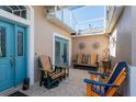 Bright covered patio with comfortable seating at 5305 Indian Ocean Loop, Tavares, FL 32778