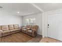 Living room with beige reclining sofas and a neutral rug at 8511 Triumph Cir, Wildwood, FL 34785