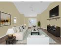 Spacious living room with vaulted ceilings, neutral walls, and a modern media console at 11631 Sw 82Nd Ter, Ocala, FL 34481