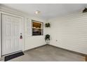 Small entryway with white door and window showing kitchen at 202 Estrada Pl, The Villages, FL 32159